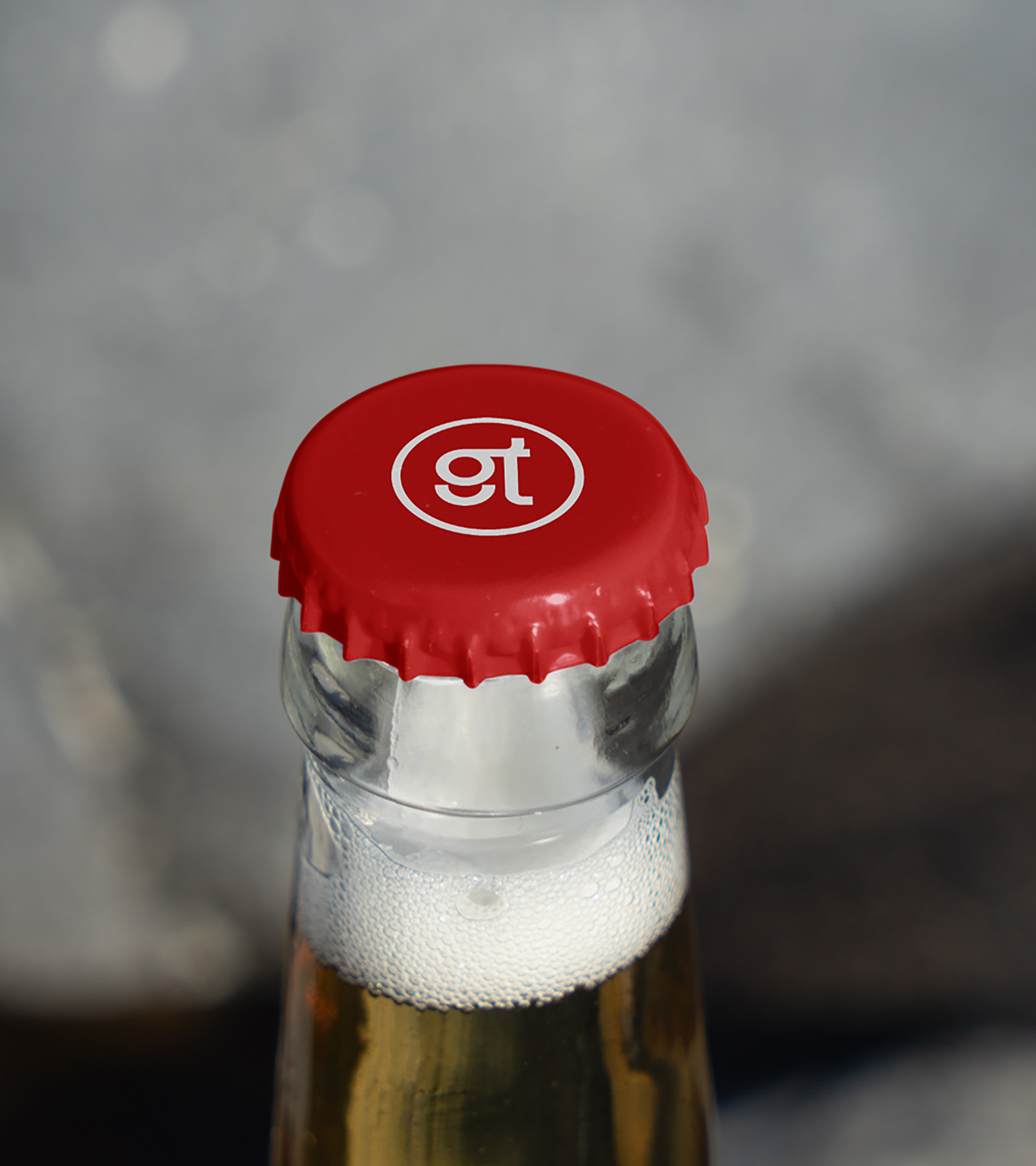 top of bottle cap showing logo